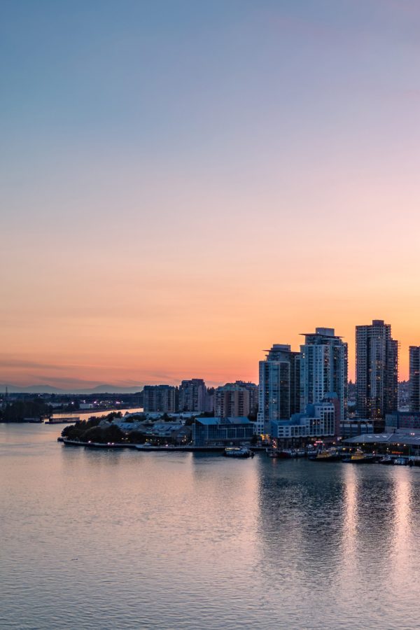 Aerial View of City Buildings by river at twilight. New Westmister, Vancouver, BC, Canada.