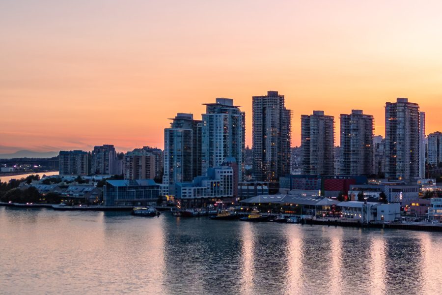 Aerial View of City Buildings by river at twilight. New Westmister, Vancouver, BC, Canada.